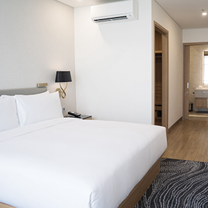 Modern Brisbane hotel room with secure electronic access control for guest safety and privacy.