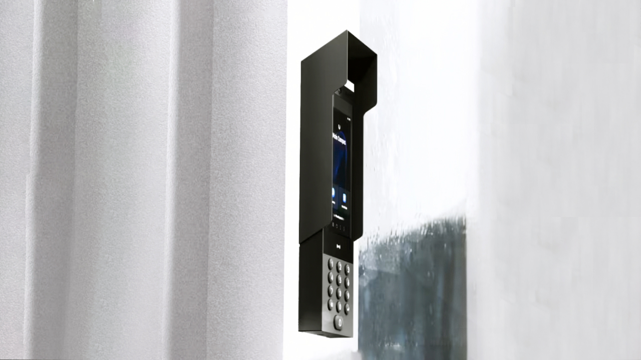 A modern wall mounted intercom system in Brisbane with a keypad and screen.